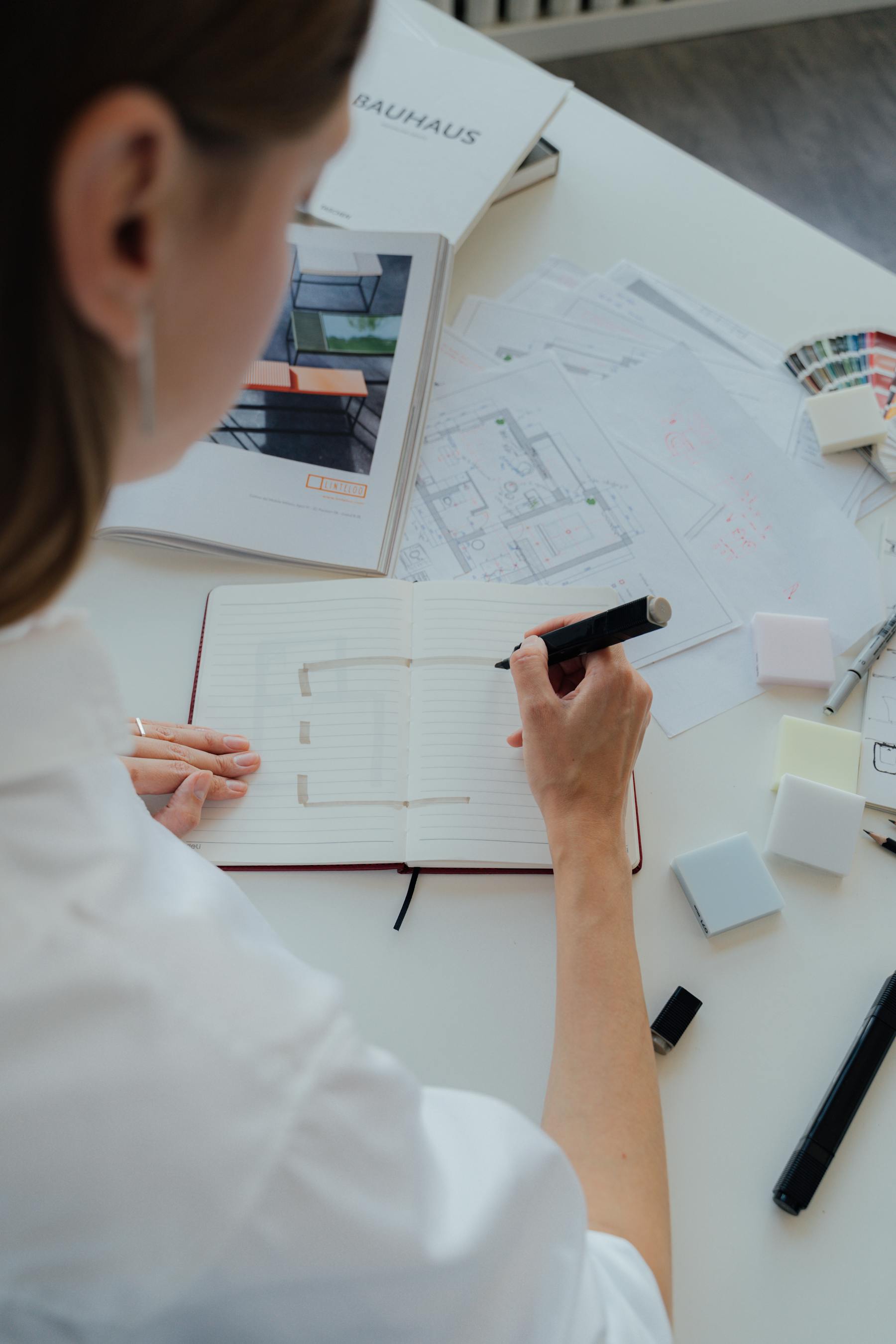 Architecture team working over plans in a professional studio